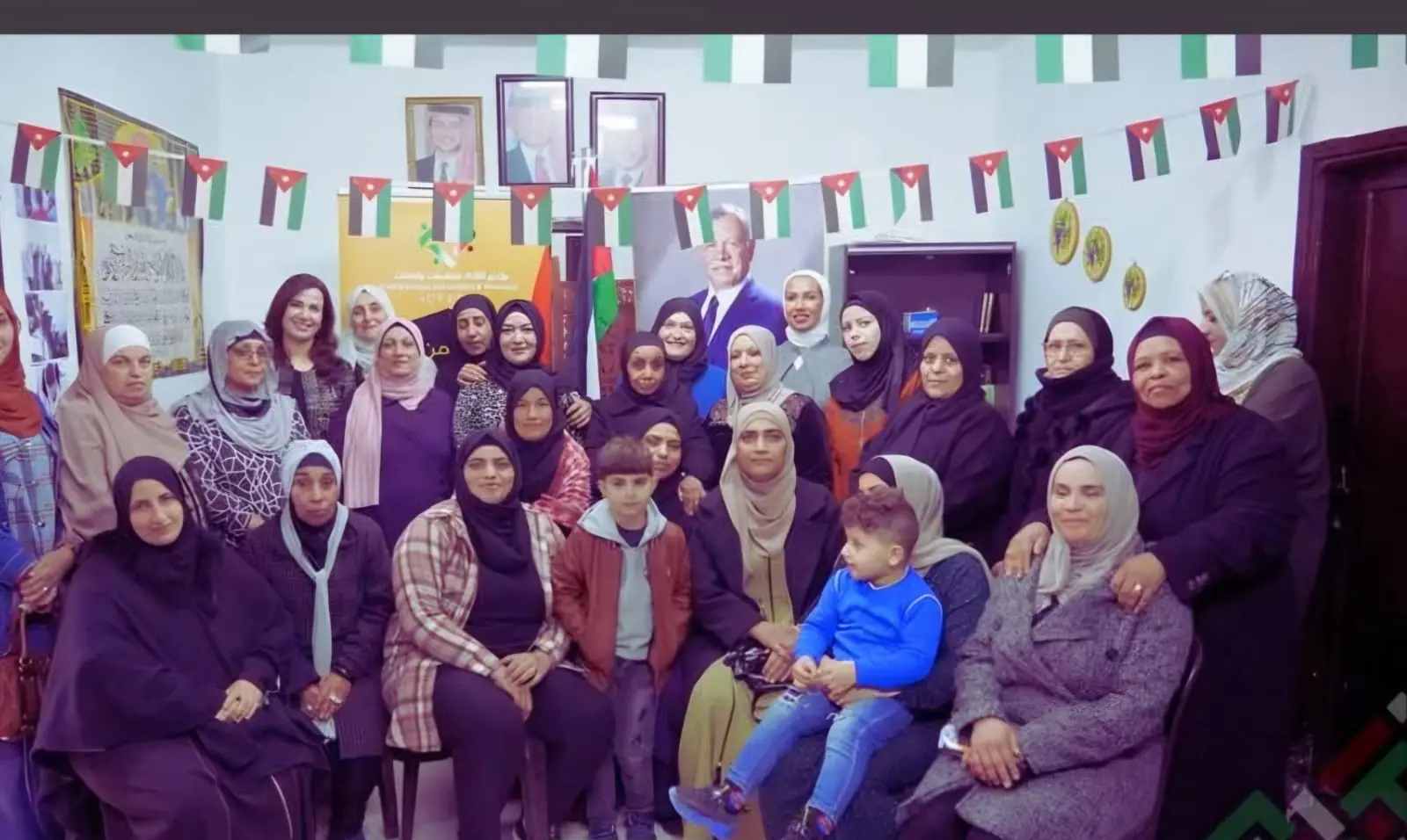Women's community gathering with Jordanian flags