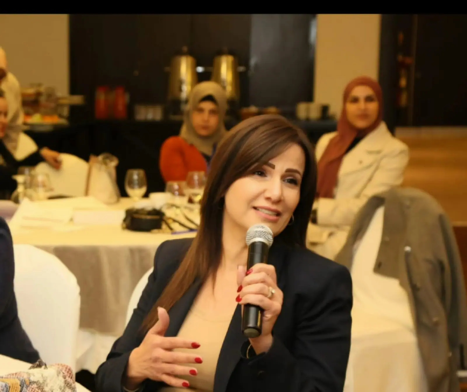 Peace Vision CEO Manal Haddad speaking at a leadership dialogue session